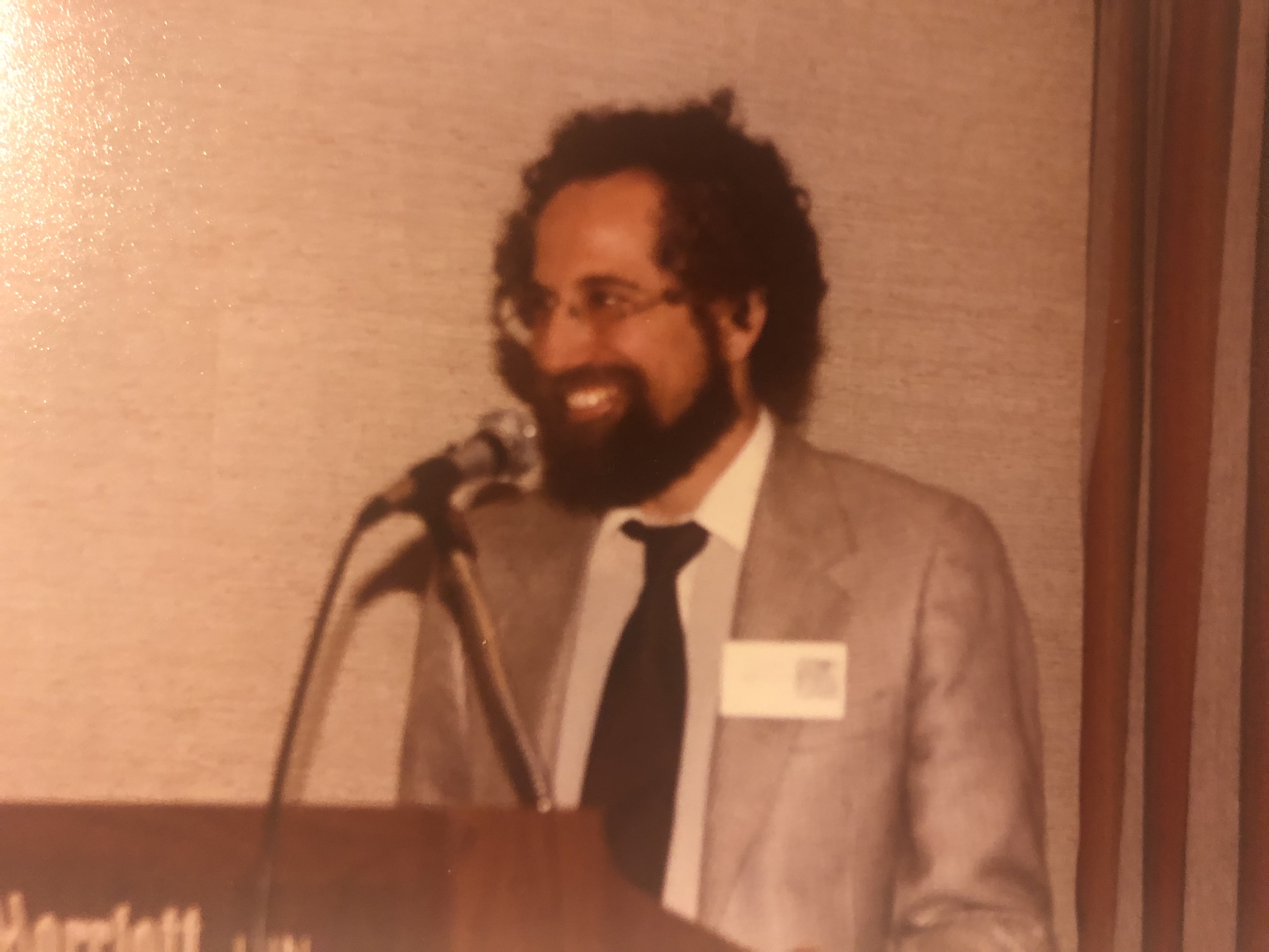 photo of David Minkus speaking at a podium