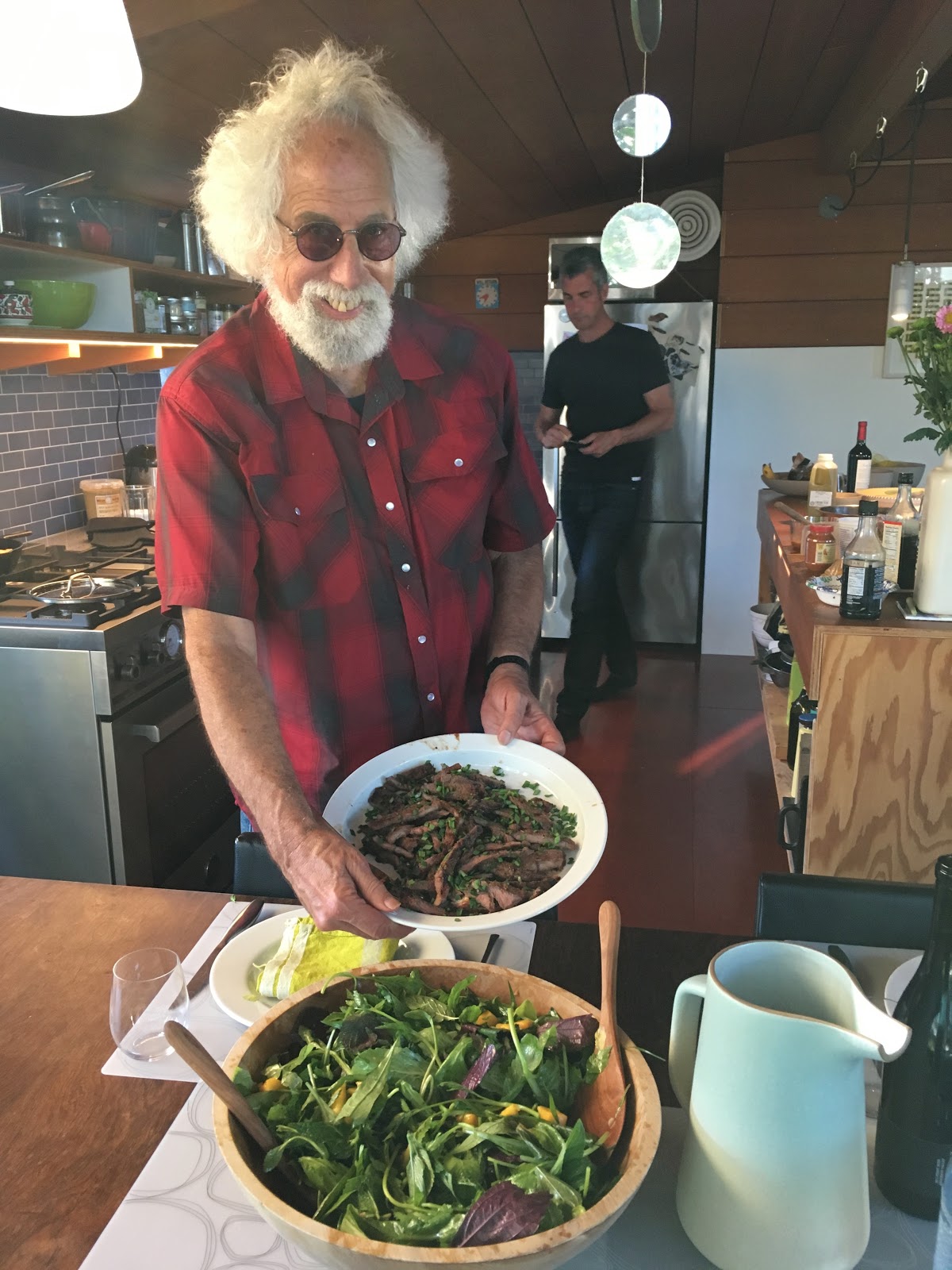 a photo of David Minkus presenting a salad