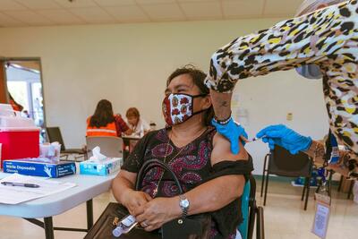 A member of the Guatemalan Maya community in Lake Worth, Fla., receives a Covid vaccine.
