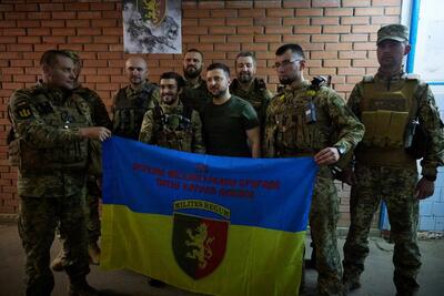 Ukrainian President Volodymyr Zelensky with soldiers in Soledar, Ukraine, June 2022