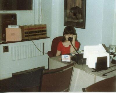 Author and USCF professor Stacy Torres at age eight, "playing office" at the workplace of a family member.