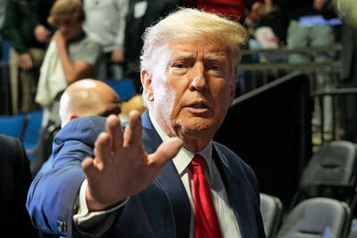 Former President Donald Trump has been indicted in New York and faces other ongoing criminal investigations. The ramifications could extend globally, Berkeley scholars say. The photo above shows Trump with his hand out towards the camera.